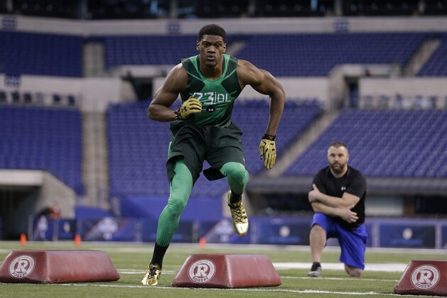 Nebraska defensive lineman Randy Gregory runs a drill at the NFL football scouting combine in Indianapolis, Sunday, Feb. 22, 2015. (AP Photo/David J. Phillip)