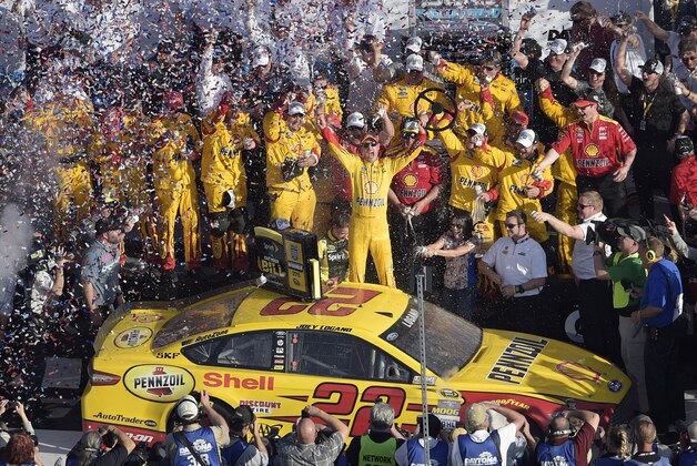 Joey Logano celebrates in Victory Lane after winning the Daytona 500 NASCAR Sprint Cup series auto race at Daytona International Speedway, Sunday, Feb. 22, 2015, in Daytona Beach, Fla. (AP Photo/Phelan M. Ebenhack)