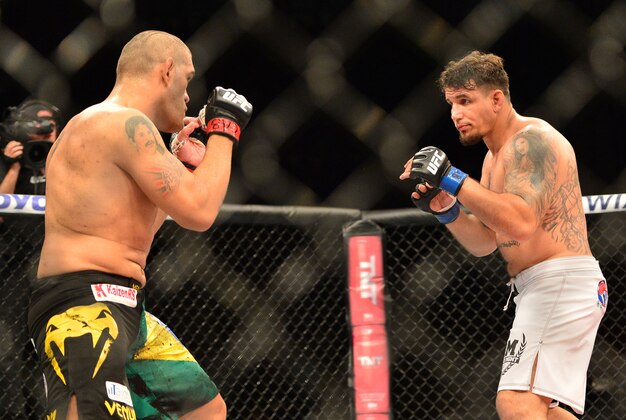 Feb 22, 2015; Porto Alegre, Brazil; Antonio Silva (red gloves) fights against Frank Mir (blue gloves) during UFC Fight Night at Ginasio do Gigantinho. Mandatory Credit: Jason da Silva-USA TODAY Sports