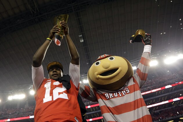 Ohio State's Cardale Jones and their mascot celebrate after the NCAA college football playoff championship game against Oregon Monday, Jan. 12, 2015, in Arlington, Texas. Ohio State won 42-20. (AP Photo/David J. Phillip)