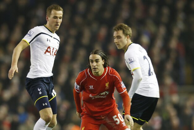 Liverpool's Lazar Markovic, center, is challenged for the ball by Tottenham's Harry Kane and Christian Eriksen, right, during the English Premier League soccer match between Liverpool and Tottenham Hotspur at Anfield Stadium, Liverpool, England, Tuesday Feb. 10, 2015. (AP Photo/Jon Super)
