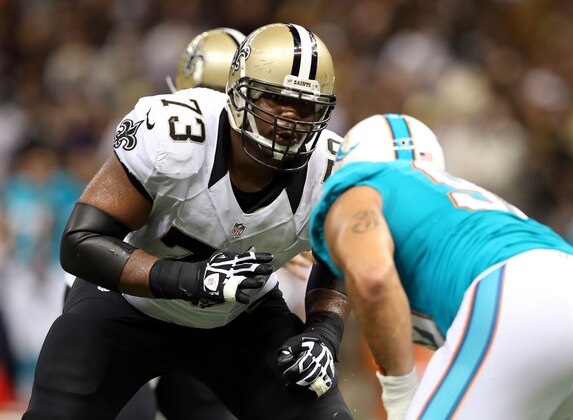 Sep 30, 2013; New Orleans, LA, USA; New Orleans Saints guard Jahri Evans (73) blocks during their game against the Miami Dolphins at the Mercedes-Benz Superdome. Mandatory Credit: Chuck Cook-USA TODAY Sports