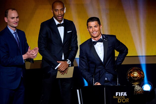 ZURICH, SWITZERLAND - JANUARY 12: FIFA Ballon d'Or winner Cristiano Ronaldo of Portugal and Real Madrid (R) speaks next to Thierry Henry (C) during the FIFA Ballon d'Or Gala 2014 at the Kongresshaus on January 12, 2015 in Zurich, Switzerland. (Photo by Philipp Schmidli/Getty Images)