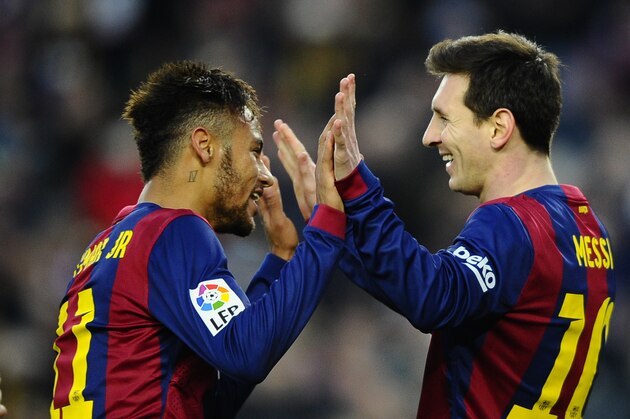 FC Barcelona's Lionel Messi, from Argentina, right, reacts after scoring with his teammate Neymar, from Brazil, against Levante during a Spanish La Liga soccer match at the Camp Nou stadium in Barcelona, Spain, Sunday, Feb. 15, 2015. (AP Photo/Manu Fernandez)