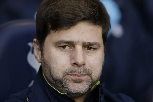 Tottenham Hotspur's head coach Mauricio Pochettino waits for the start of the English Premier League soccer match between Tottenham Hotspur and Burnley at White Hart Lane stadium in London, Saturday, Dec. 20, 2014.  (AP Photo/Matt Dunham)
