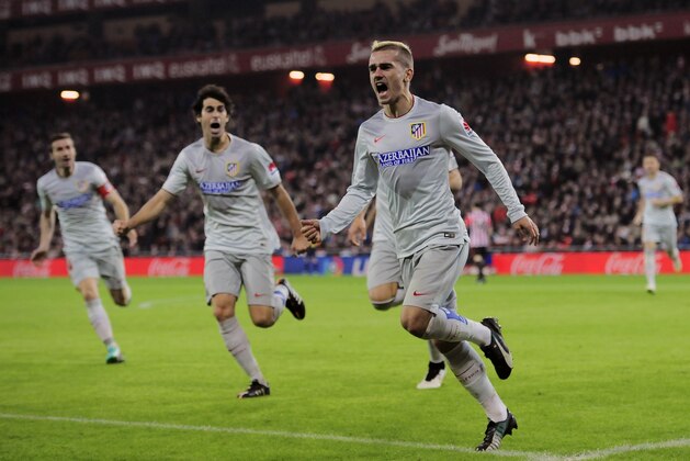 Atletico de Madrid's Antoine Griezmann celebrates his goal against Athletic Bilbao, during their La Liga soccer match, at San Mames stadium, in Bilbao, northern Spain, Sunday, Dec. 21, 2014. (AP Photo/Alvaro Barrientos)
