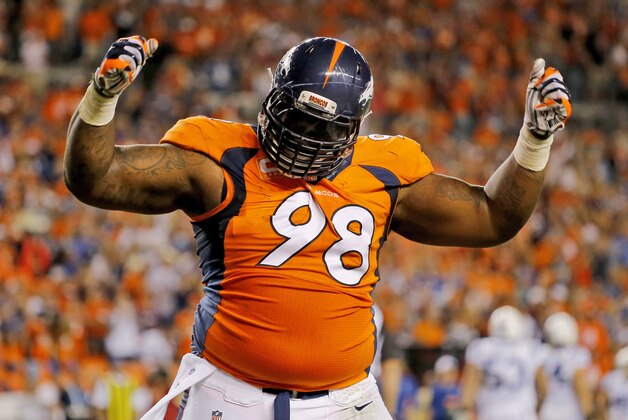 FILE - In this Sept. 7, 2014, file photo, Denver Broncos defensive tackle Terrance Knighton (98) celebrates a stop during the second half of an NFL football game against the Indianapolis Colts in Denver. Knighton isn't backing down from his Super Bowl guarantee, saying anything less than a world championship will be a disappointing season for the star-studded Denver Broncos.  (AP Photo/Jack Dempsey, File)