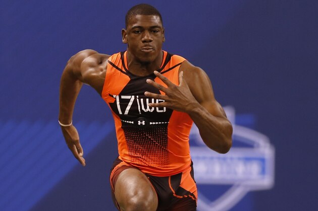 Michigan wide receiver Devin Funchess runs the 40-yard dash at the NFL football scouting combine in Indianapolis, Saturday, Feb. 21, 2015. (AP Photo/Julio Cortez)