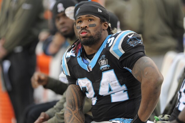 Carolina Panthers' DeAngelo Williams (34) watches the scoreboard in the second half of an NFL football game against the Atlanta Falcons in Charlotte, N.C., Sunday, Nov. 16, 2014. The Falcons won 19-17. (AP Photo/Mike McCarn)