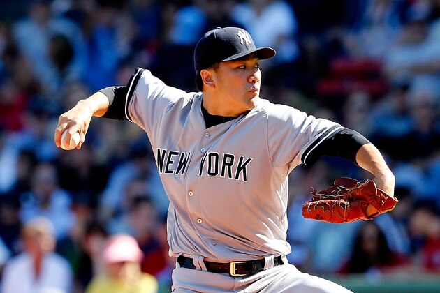 BOSTON, MA - SEPTEMBER 27:  Masahiro Tanaka #19 of the New York Yankees pitches against the Boston Red Sox in the first inning during a game at Fenway Park on September 27, 2014 in Boston, Massachusetts.  (Photo by Jim Rogash/Getty Images)