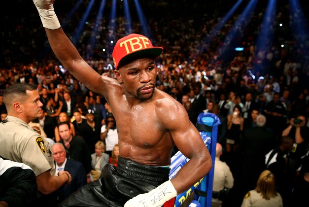 May 3, 2014; Las Vegas, NV, USA; Floyd Mayweather Jr. celebrates after defeating Marcos Maidana (not pictured) during their fight at the MGM Grand. Mandatory Credit: Mark J. Rebilas-USA TODAY Sports