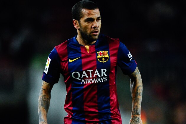 BARCELONA, SPAIN - FEBRUARY 01:  Dani Alves of FC Barcelona runs with the ball during the La Liga match between FC Barcelona and Villarreal CF at Camp Nou on February 1, 2015 in Barcelona, Spain.  (Photo by David Ramos/Getty Images)