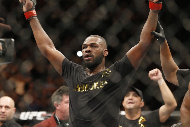 Jon Jones celebrates after defeating Daniel Cormier during their light heavyweight title mixed martial arts bout at UFC 182, Saturday, Jan. 3, 2015, in Las Vegas. (AP Photo/John Locher)