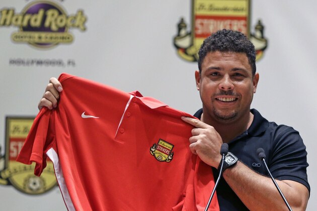 Three-time FIFA player of the year Ronaldo Luís Nazário de Lima poses for photographers with a Fort Lauderdale Strikers jersey after talking about his new role as part owner of the Fort Lauderdale Strikers  during a news conference Wednesday, Jan. 14, 2015, in Hollywood, Fla. Ronaldo says he will attempt to make a playing comeback this spring with the Fort Lauderdale Strikers of the second-tier North American Soccer League.(AP Photo/Alan Diaz)