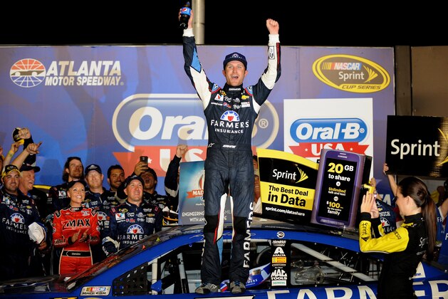 HAMPTON, GA - AUGUST 31:  Kasey Kahne, driver of the #5 Farmers Insurance Chevrolet, celebrates in Victory Lane after winning the NASCAR Sprint Cup Series Oral-B USA 500 at Atlanta Motor Speedway on August 31, 2014 in Hampton, Georgia.  (Photo by Jonathan Moore/Getty Images)