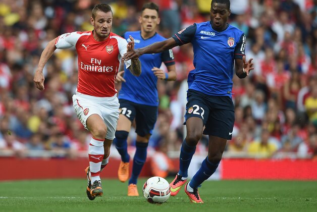 LONDON, ENGLAND - AUGUST 03: Mathieu Debuchy of Arsenal in action with Geoffrey Kondogbia of Monaco during the Emirates Cup match between Arsenal and AS Monaco at the Emirates Stadium on August 3, 2014 in London, England.  (Photo by Michael Regan/Getty Images)