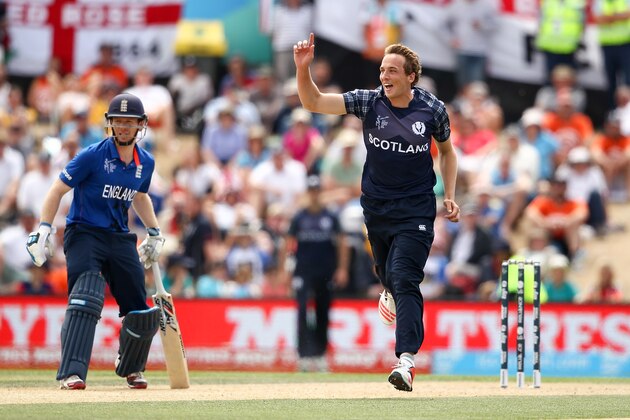 CHRISTCHURCH, NEW ZEALAND - FEBRUARY 23:  Josh Davey of Scotland celebrates with team mates after dismissing James Taylor of England during the 2015 ICC Cricket World Cup match between England and Scotland at Hagley Oval on February 23, 2015 in Christchurch, New Zealand.  (Photo by Martin Hunter/Getty Images)