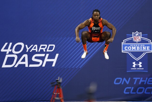 Georgia wide receiver Chris Conley prepares to run the 40-yard dash at the NFL football scouting combine in Indianapolis, Saturday, Feb. 21, 2015. (AP Photo/Julio Cortez)