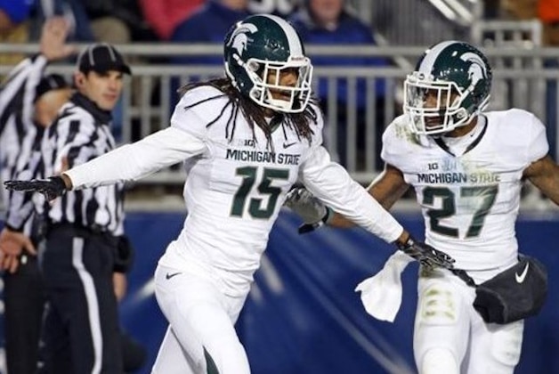 Michigan State cornerback Trae Waynes (15) celebrates with Kurtis Drummond (27) after intercepting a pass in the end zone for a touchback during the second half of an NCAA college football game in State College, Pa., Saturday, Nov. 29, 2014. (AP Photo/Gene J. Puskar)