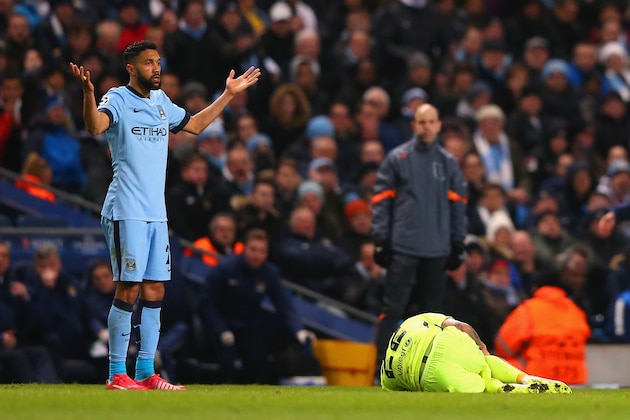 MANCHESTER, ENGLAND - FEBRUARY 24:  Gael Clichy of Manchester City appeals to the Referee after a challenge on Daniel Alves of Barcelona during the UEFA Champions League Round of 16 match between Manchester City and Barcelona at Etihad Stadium on February 24, 2015 in Manchester, United Kingdom.  (Photo by Alex Livesey/Getty Images)