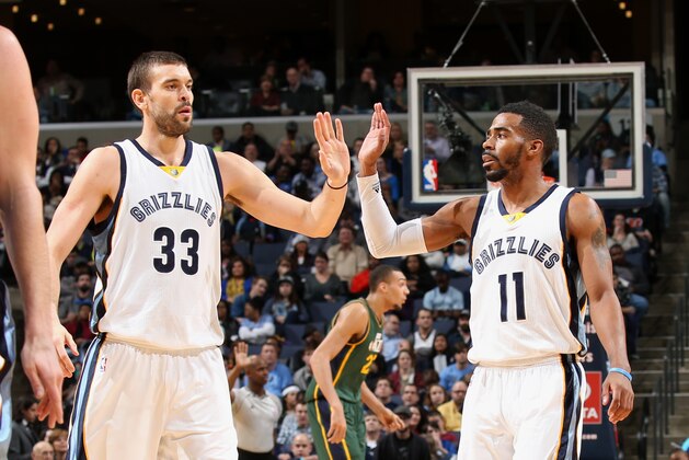 MEMPHIS, TN - DECEMBER 22: Marc Gasol #33 and Mike Conley #11 of the Memphis Grizzlies celebrate during a game against the Utah Jazz on December 22, 2014 at FedExForum in Memphis, Tennessee. NOTE TO USER: User expressly acknowledges and agrees that, by downloading and or using this photograph, User is consenting to the terms and conditions of the Getty Images License Agreement. Mandatory Copyright Notice: Copyright 2014 NBAE (Photo by Joe Murphy/NBAE via Getty Images)