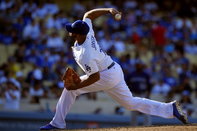 Los Angeles Dodgers relief pitcher Kenley Jansen throws to the plate during the ninth inning of a baseball game against the Colorado Rockies, Sunday, Sept. 28, 2014, in Los Angeles. The Dodgers won 10-5. (AP Photo/Mark J. Terrill)