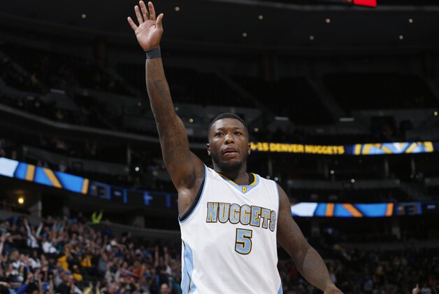 Denver Nuggets guard Nate Robinson celebrates as time runs down in the Nuggets' NBA basketball game against the Orlando Magic on Wednesday, Jan. 7, 2015, in Denver. The Nuggets won 93-90. (AP Photo/David Zalubowski)