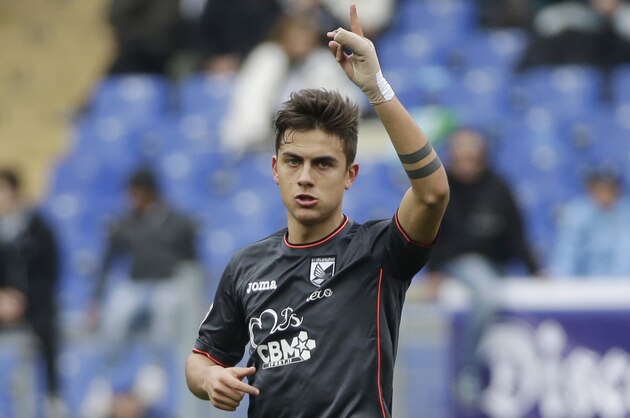 Palermo’s Paulo Dybala celebrates after he scored during a Serie A soccer match between Roma and Palermo, at Rome's Olympic Stadium, Sunday, Feb. 22, 2015. (AP Photo/Andrew Medichini)