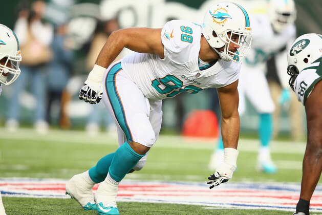 EAST RUTHERFORD, NJ - DECEMBER 01:  Jared Odrick #98 of the Miami Dolphins in action against the New York Jets during their game at MetLife Stadium on December 1, 2013 in East Rutherford, New Jersey.  (Photo by Al Bello/Getty Images)