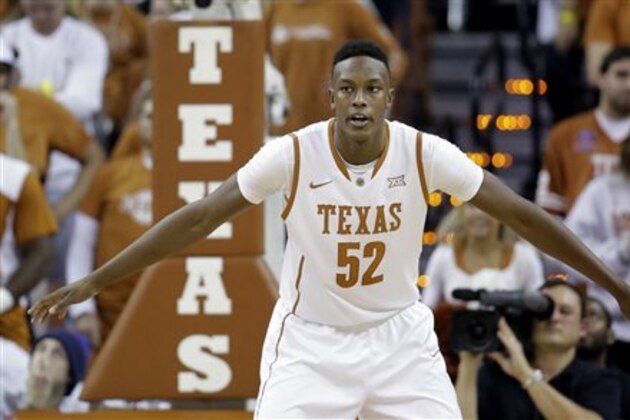 FILE - In this Nov. 16, 2014, file photo, Texas’ Myles Turner defends during the second half of an NCAA college basketball game against Alcorn State in Austin, Texas. Texas basketball is rolling _ both the men and the women _ and making a splash among the nation’s best just two seasons after both had seemed to hit bottom.  (AP Photo/Eric Gay, File)