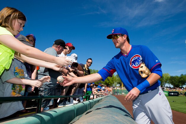 Mar 10, 2014; Scottsdale, AZ, USA; Chicago Cubs third baseman Kris Bryant signs autographs prior to the game against the San Francisco Giants at Scottsdale Stadium. Mandatory Credit: Mark J. Rebilas-USA TODAY Sports