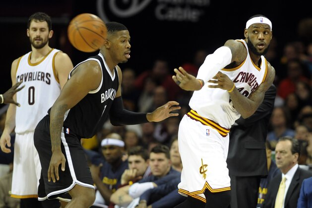 Dec 19, 2014; Cleveland, OH, USA; Cleveland Cavaliers forward LeBron James (23) makes a pass against the Brooklyn Nets during the second quarter at Quicken Loans Arena. Mandatory Credit: Ken Blaze-USA TODAY Sports
