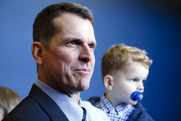 Dec 30, 2014; Ann Arbor, MI, USA; Jim Harbaugh is seen with his son Jack after he is introduced as the new head football coach of the Michigan Wolverines at Jonge Center. Mandatory Credit: Rick Osentoski-USA TODAY Sports