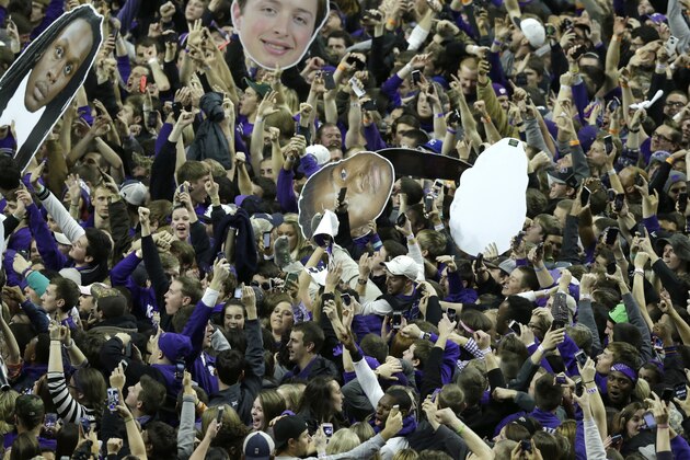 Kansas State fans celebrate victory following an NCAA college basketball game against Kansas at Bramlage Coliseum in Manhattan, Kan., Monday, Feb. 23, 2015. Kansas State defeated Kansas 70-63. (AP Photo/Orlin Wagner)