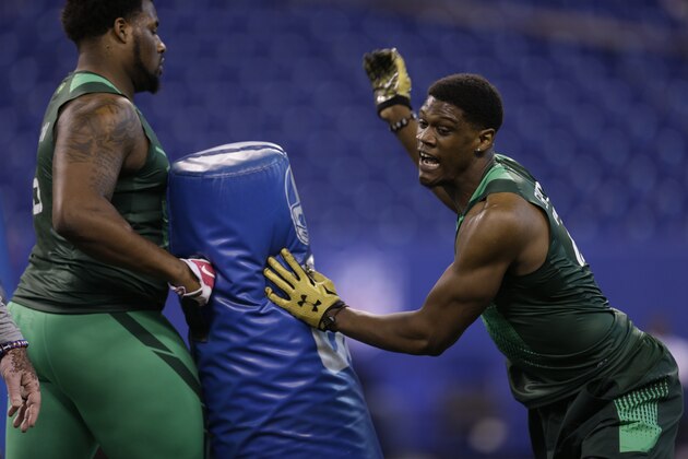 Nebraska defensive lineman Randy Gregory runs a drill at the NFL football scouting combine in Indianapolis, Sunday, Feb. 22, 2015. (AP Photo/David J. Phillip)