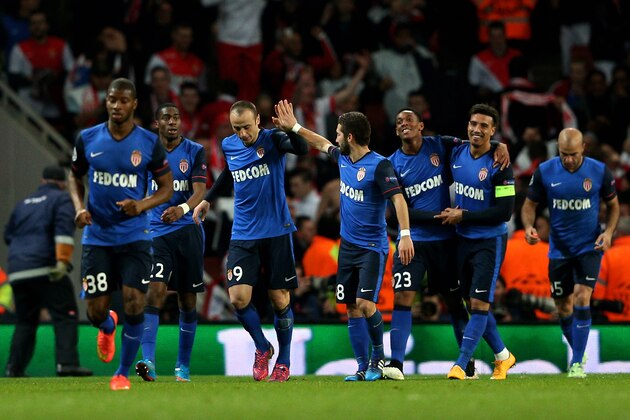 LONDON, ENGLAND - FEBRUARY 25:  Dimitar Berbatov #9 (3rd L) of Monaco celebrates with teammates after scorin his team's second goal during the UEFA Champions League round of 16, first leg match between Arsenal and Monaco at The Emirates Stadium on February 25, 2015 in London, United Kingdom.  (Photo by Clive Mason/Getty Images)