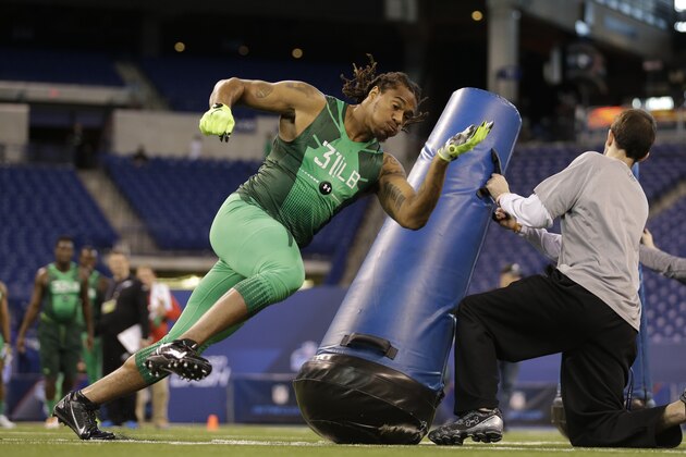 Washington linebacker Shaq Thompson runs a drill at the NFL football scouting combine in Indianapolis, Sunday, Feb. 22, 2015. (AP Photo/David J. Phillip)