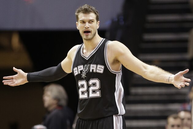 San Antonio Spurs' Tiago Splitter (22) reacts to a call during the second half of an NBA basketball game against the Charlotte Hornets  in Charlotte, N.C., Wednesday, Jan. 14, 2015. The Spurs won 98-93. (AP Photo/Chuck Burton)