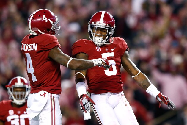 TUSCALOOSA, AL - NOVEMBER 15:  Cyrus Jones #5 of the Alabama Crimson Tide reacts after intercepting a touchdown reception intended for De'Runnya Wilson #1 of the Mississippi State Bulldogs with Eddie Jackson #4 at Bryant-Denny Stadium on November 15, 2014 in Tuscaloosa, Alabama.  (Photo by Kevin C. Cox/Getty Images)