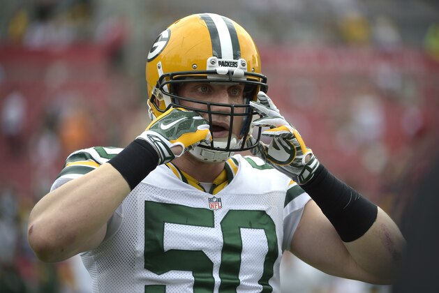 Green Bay Packers inside linebacker A.J. Hawk (50) warms up before an NFL football game against the Tampa Bay Buccaneers in Tampa, Fla., Sunday, Dec. 21, 2014.(AP Photo/Phelan M. Ebenhack)
