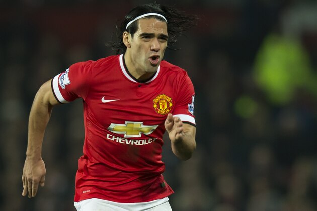 Manchester United's Radamel Falcao takes the ball downfield during the English Premier League soccer match between Manchester United and Burnley at Old Trafford Stadium, Manchester, England, Wednesday Feb. 11, 2015. (AP Photo/Jon Super)