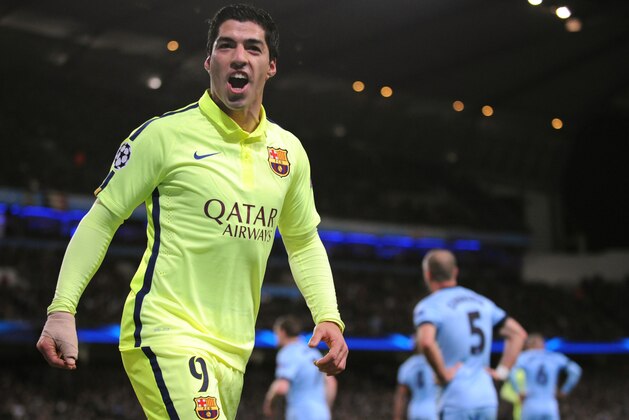 Barcelona's Luis Suarez celebrates after scoring his second goal against Manchester City during the Champions League round 16 match between Manchester City and Barcelona at the Etihad Stadium, in Manchester, England, Tuesday, Feb. 24, 2015. (AP Photo/Rui Vieira)