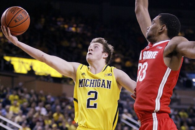 ANN ARBOR, MI - FEBRUARY 22:  Spike Albrecht #2 of the Michigan Wolverines goes to the basket past Keita Bates-Diop #33 of the Ohio State Buckeyes during the first half at Crisler Arena on February 22, 2015 in Ann Arbor, Michigan. (Photo by Duane Burleson/Getty Images)