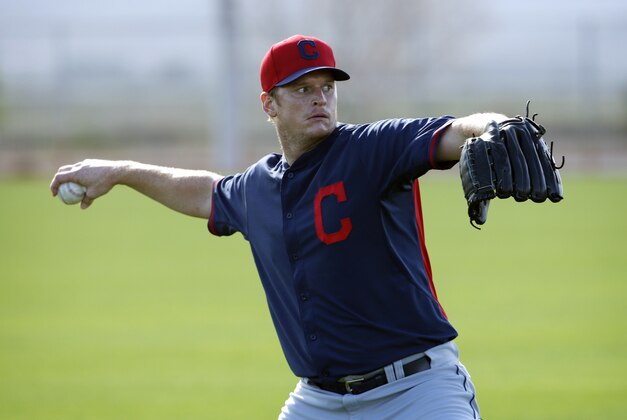 Cleveland Indians' Gavin Floyd warms up during a spring training baseball practice Sunday, Feb. 22, 2015, in Goodyear, Ariz. (AP Photo/John Locher)