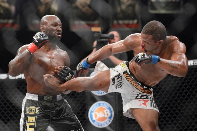 Nov 2, 2013; Long Beach, CA, USA;   Emanuel Newton (blue gloves) and Muhammed Lawal (red gloves) during their Bellator interim light heavyweight world title fight at the Long Beach Arena. Newton won the fight. Mandatory Credit: Jayne Kamin-Oncea-USA TODAY Sports