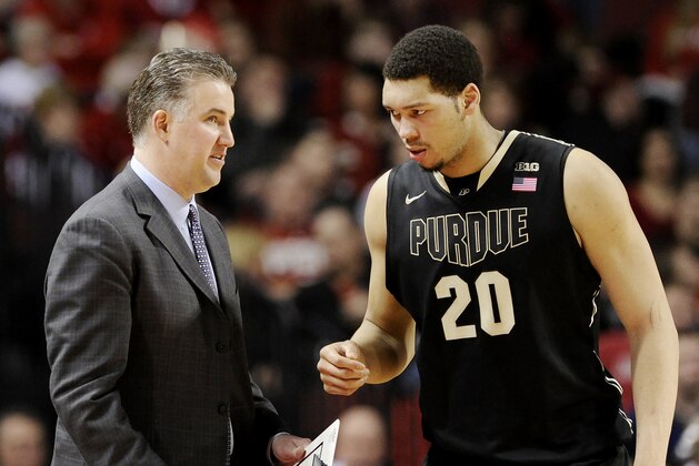 Purdue head coach Matt Painter, left, talks with Purdue center A. J. Hammons (20) during the second half of an NCAA college basketball game in Lincoln, Neb., on Sunday, Feb. 23, 2014. (AP Photo/Francis Gardler)
