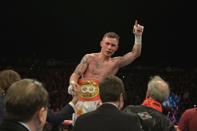 BELFAST, NORTHERN IRELAND - SEPTEMBER 6: The new IBF super-bantamweight world champion Carl Frampton of Northern Ireland celebrates after his victory over Kiko Martinez of Spain, at the purpose-built 16,000 capacity Titanic slipway outdoor arena on September 6, 2014 in Belfast, Northern Ireland. (Photo by Charles McQuillan/Getty Images).
