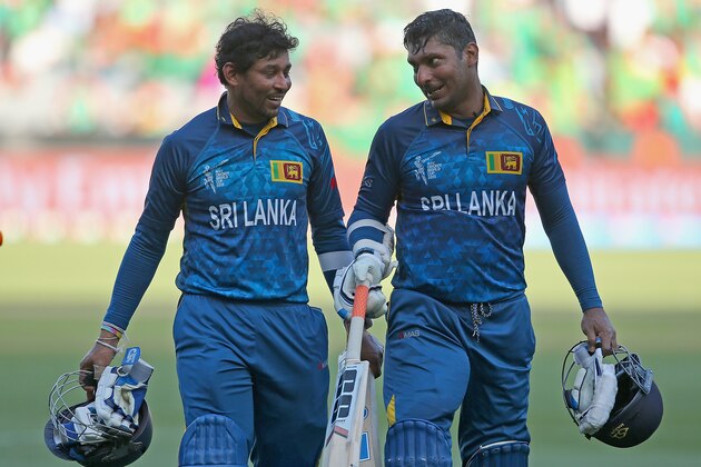 MELBOURNE, AUSTRALIA - FEBRUARY 26:  Tillakaratne Dilshan and Kumar Sangakkara of Sri Lanka walk off the field during the 2015 ICC Cricket World Cup match between Sri Lanka and Bangladesh at Melbourne Cricket Ground on February 26, 2015 in Melbourne, Australia.  (Photo by Quinn Rooney/Getty Images)