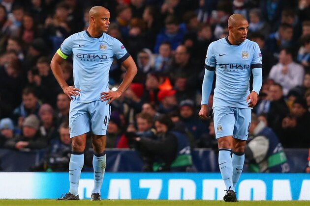 MANCHESTER, ENGLAND - FEBRUARY 24:  A dejected Vincent Kompany and Fernando of Manchester City look on during the UEFA Champions League Round of 16 match between Manchester City and Barcelona at Etihad Stadium on February 24, 2015 in Manchester, United Kingdom.  (Photo by Alex Livesey/Getty Images)