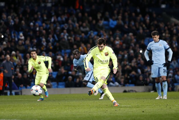 Barcelona's Lionel Messi kicks a penalty during the Champions League Round of 16 soccer match between Manchester City and Barcelona at Etihad Stadium in Manchester, England, Tuesday, Feb. 24, 2015. Barcelona won 2-1. (AP Photo/Jon Super)